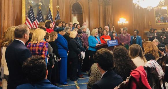 Congresswoman Clark stands with other members of Congress at a press conference highlighting bills that would protect working families.