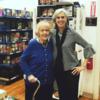 Congresswoman Clark poses for a picture with a constituent while touring a senior center's food pantry.