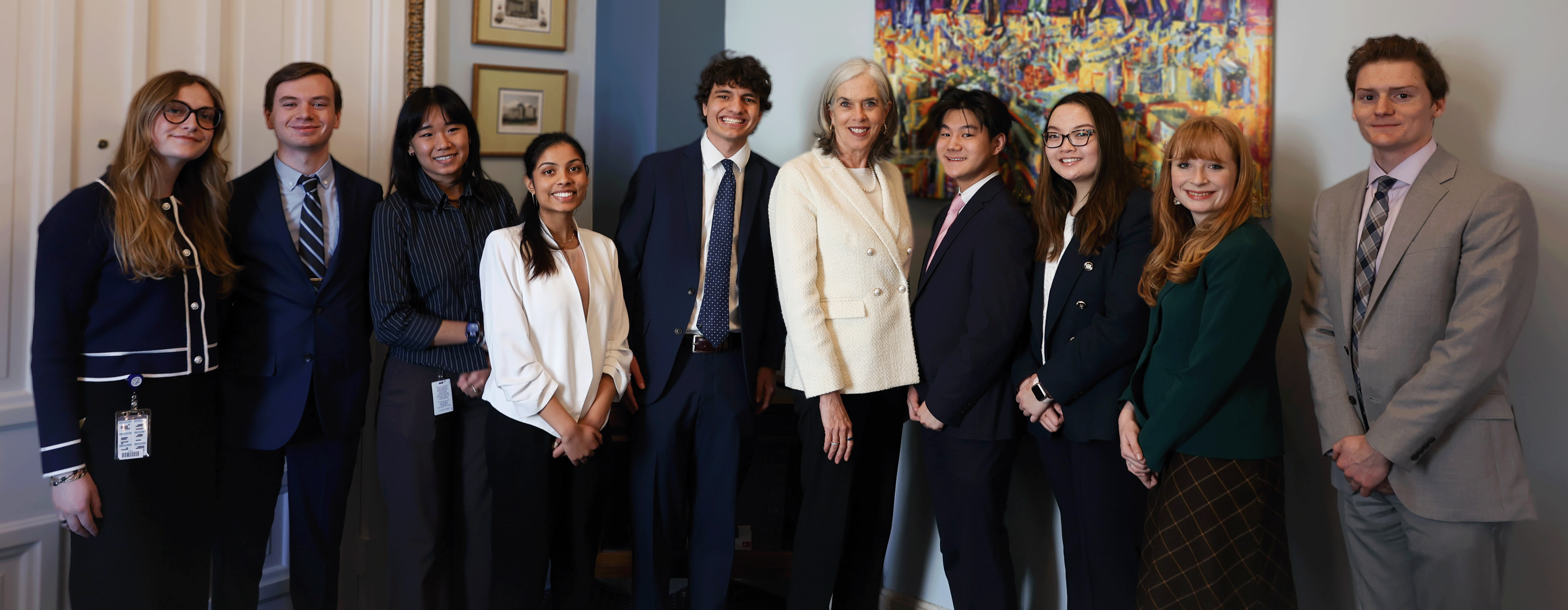 Interns from the Spring 2024 session pose with Democratic Whip Katherine Clark in front of her office.