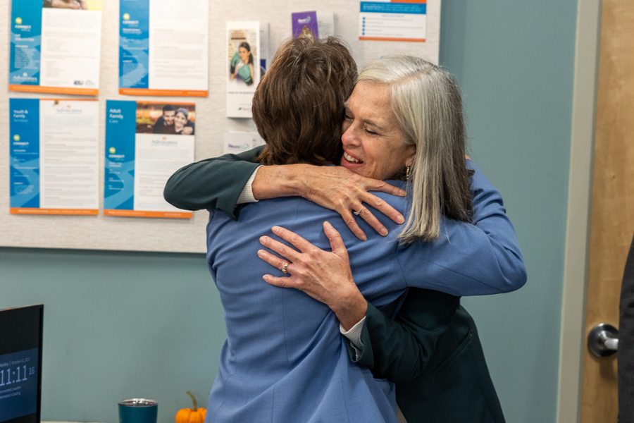 Rep. Clark hugs a mental health care professional in Framingham at a facility that Rep. Clark help secure funding to expand services.