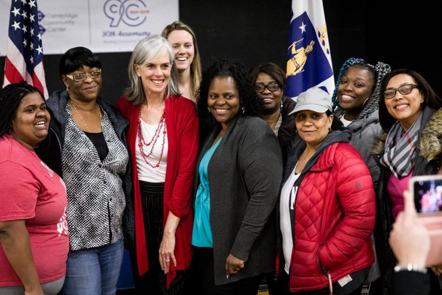 Rep. Clark poses for a picture with child care educators after a town hall in Cambridge.