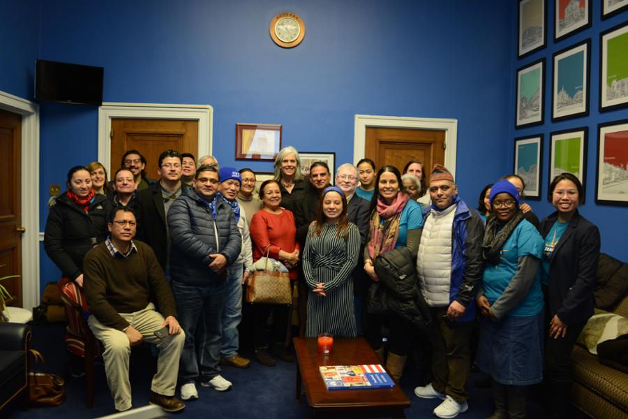 Rep. Clark poses for a picture with a group of immigrants at her Washington D.C. office.