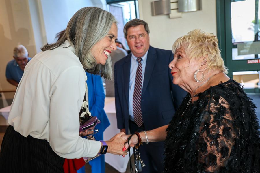 Rep. Clark shakes hands with a senior citizen at the Jack Satter House in Revere.