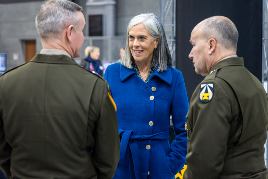 Rep. Clark speaks with two active duty soldiers at an Army base in Natick.
