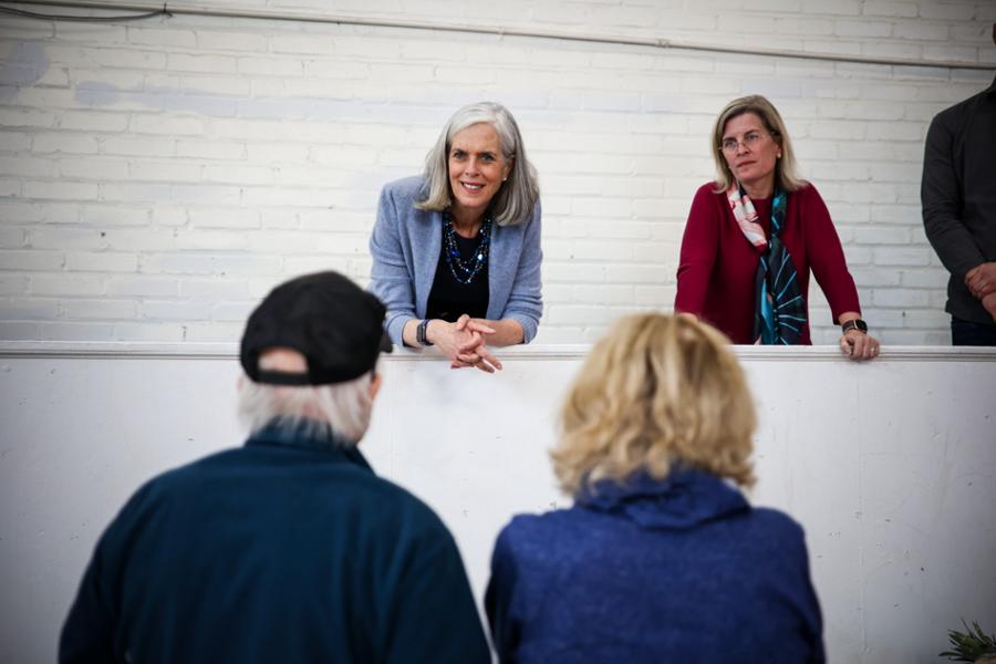 Rep. Clark listens to a pair of senior citizens while touring a Cambridge food bank.