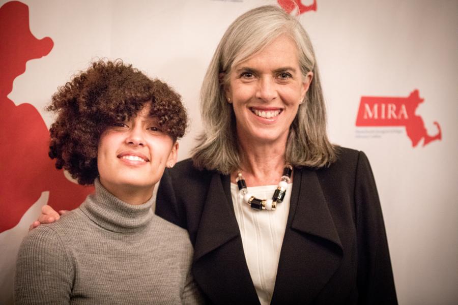 Rep. Clark poses for a picture with a young woman while they both attend an event for a nonprofit that helps immigrants in Boston.
