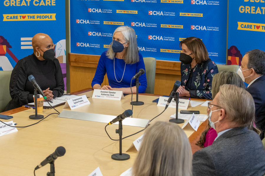 Rep. Clark sits next to Speaker Nancy Pelosi and Rep. Ayanna Pressley at the Cambridge Health Alliance. They are speaking with providers about challenges they faced during the pandemic.