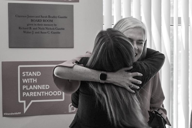Rep. Clark hugs an abortion provider at the Boston Planned Parenthood.